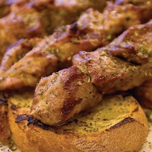 Pork on a stick with bread